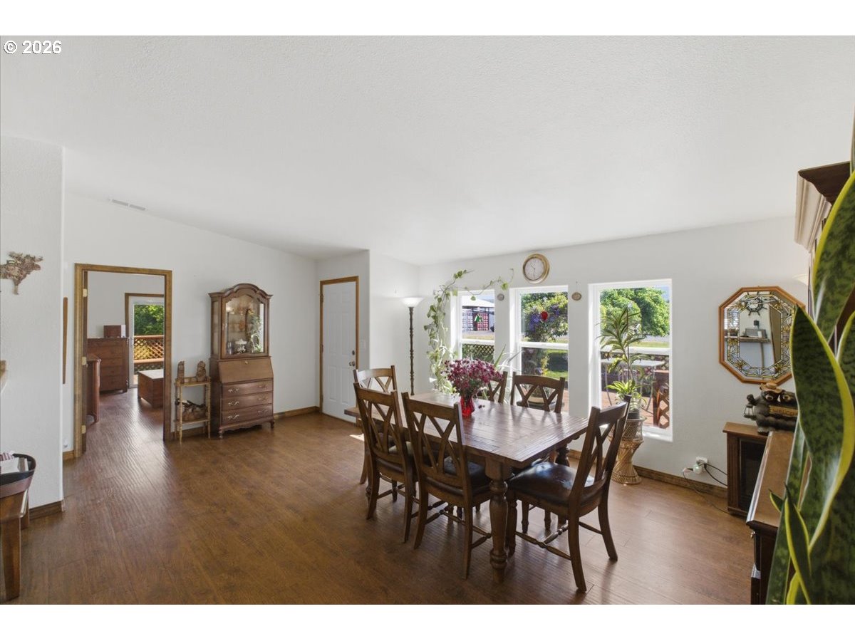 35377 Ede Road Lebanon, OR 97355 - Photo 7 of 48 a view of a dining room with furniture window and wooden floor