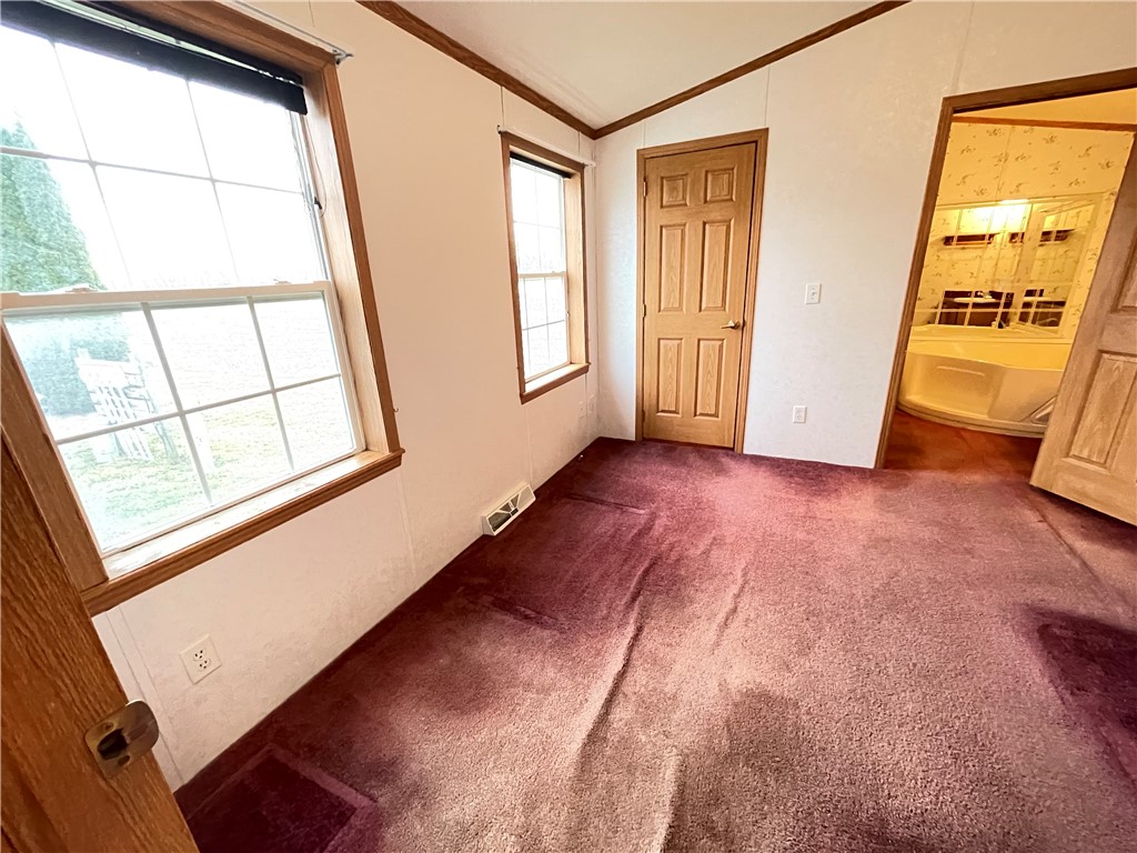 404 Tailrace Lane Mount Morris, NY 14510 - Photo 11 of 31 Primary Bedroom (view exiting Kitchen Area).