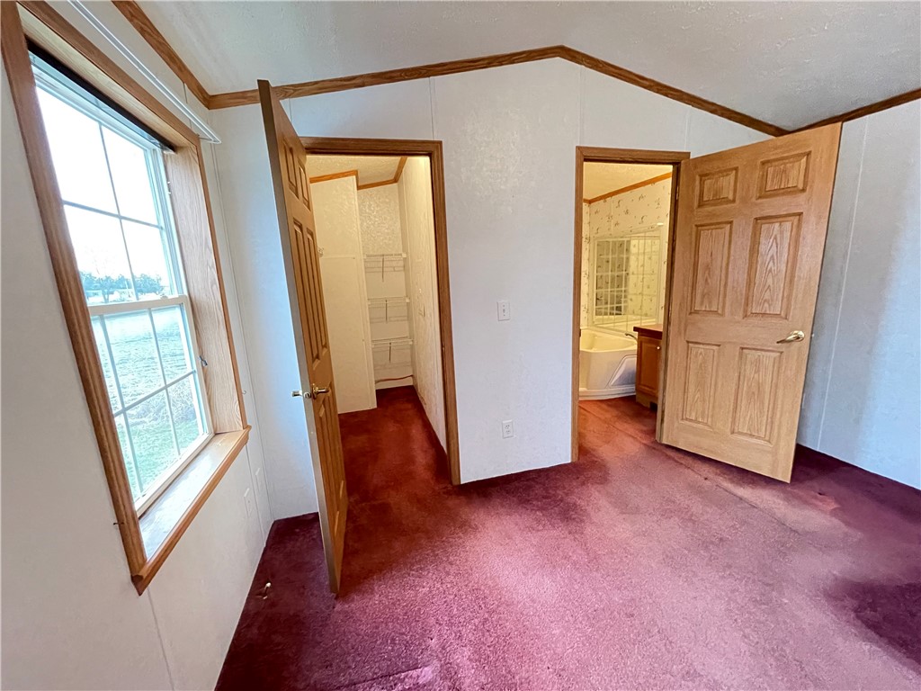 404 Tailrace Lane Mount Morris, NY 14510 - Photo 12 of 31 Primary Bedroom - with views leading to walk-in cl