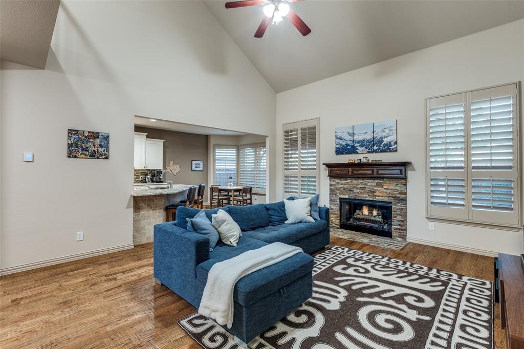 1445 Stagecoach Way Frisco, TX 75033 - Photo 12 of 39 a living room with furniture and a fireplace