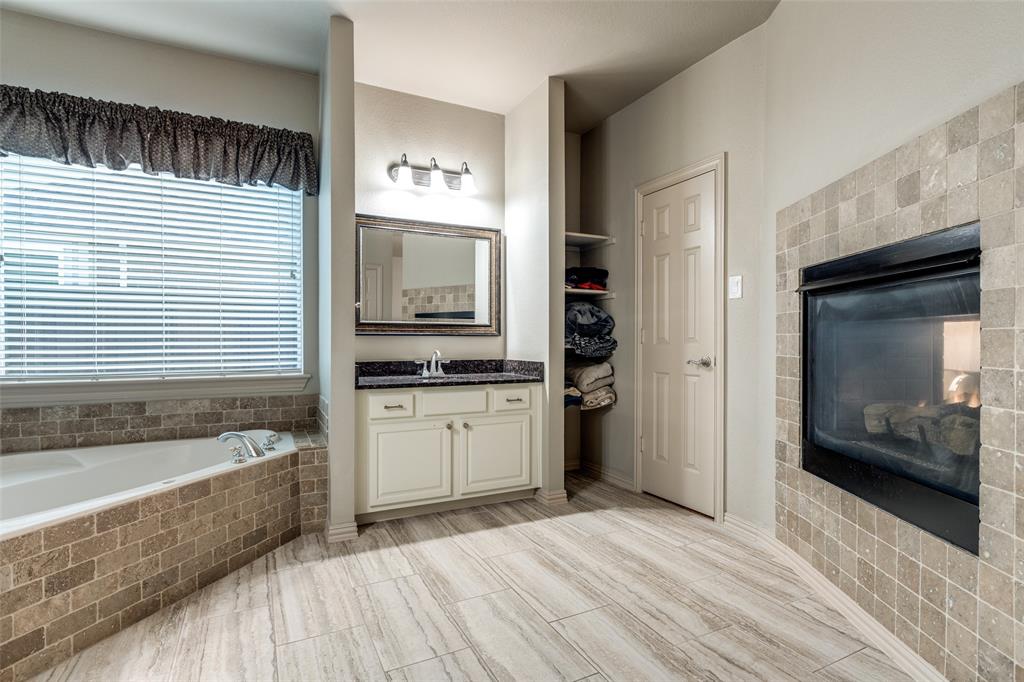 1445 Stagecoach Way Frisco, TX 75033 - Photo 25 of 39 a kitchen with a refrigerator and a sink