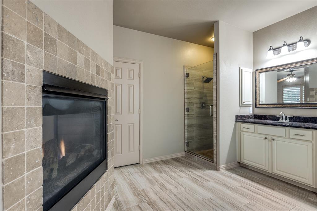 1445 Stagecoach Way Frisco, TX 75033 - Photo 26 of 39 a bathroom with a sink and a mirror