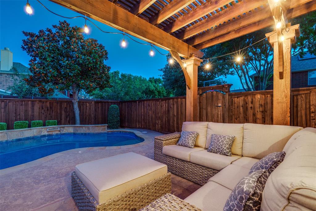 1445 Stagecoach Way Frisco, TX 75033 - Photo 32 of 39 a view of a backyard with couches plants and wooden fence