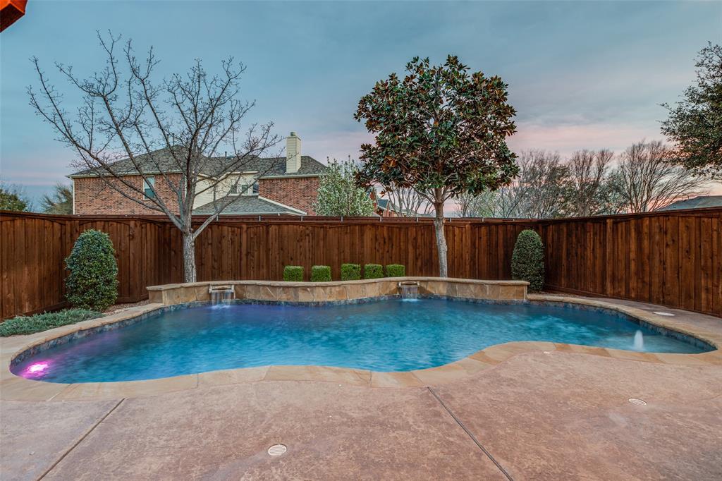 1445 Stagecoach Way Frisco, TX 75033 - Photo 36 of 39 a view of a backyard with wooden fence