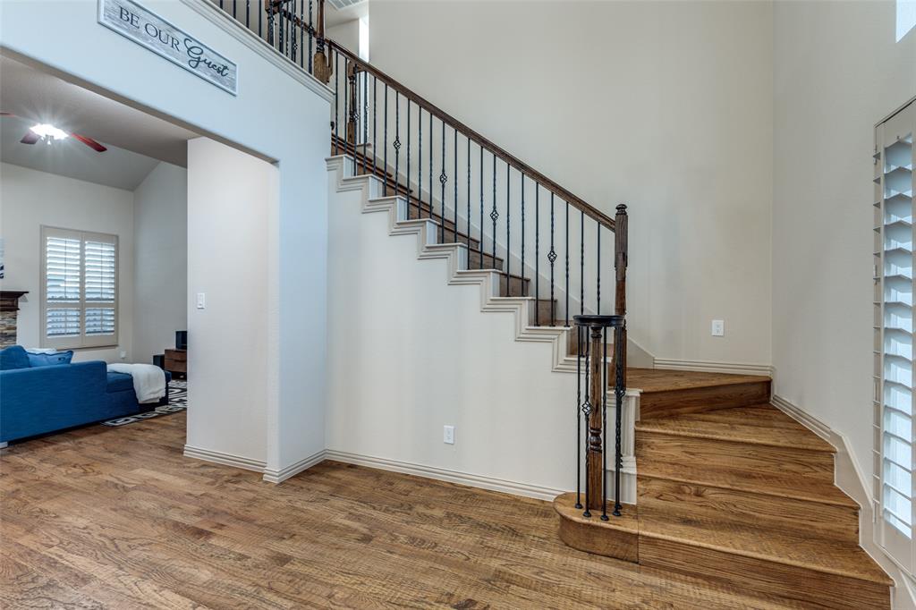 1445 Stagecoach Way Frisco, TX 75033 - Photo 8 of 39 a view of entryway and hall with wooden floor