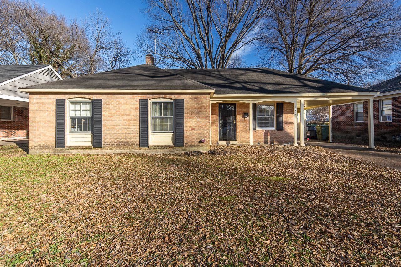1632 Ivy Road Memphis, TN 38117 - Photo 1 of 14 a front view of a house with a garden
