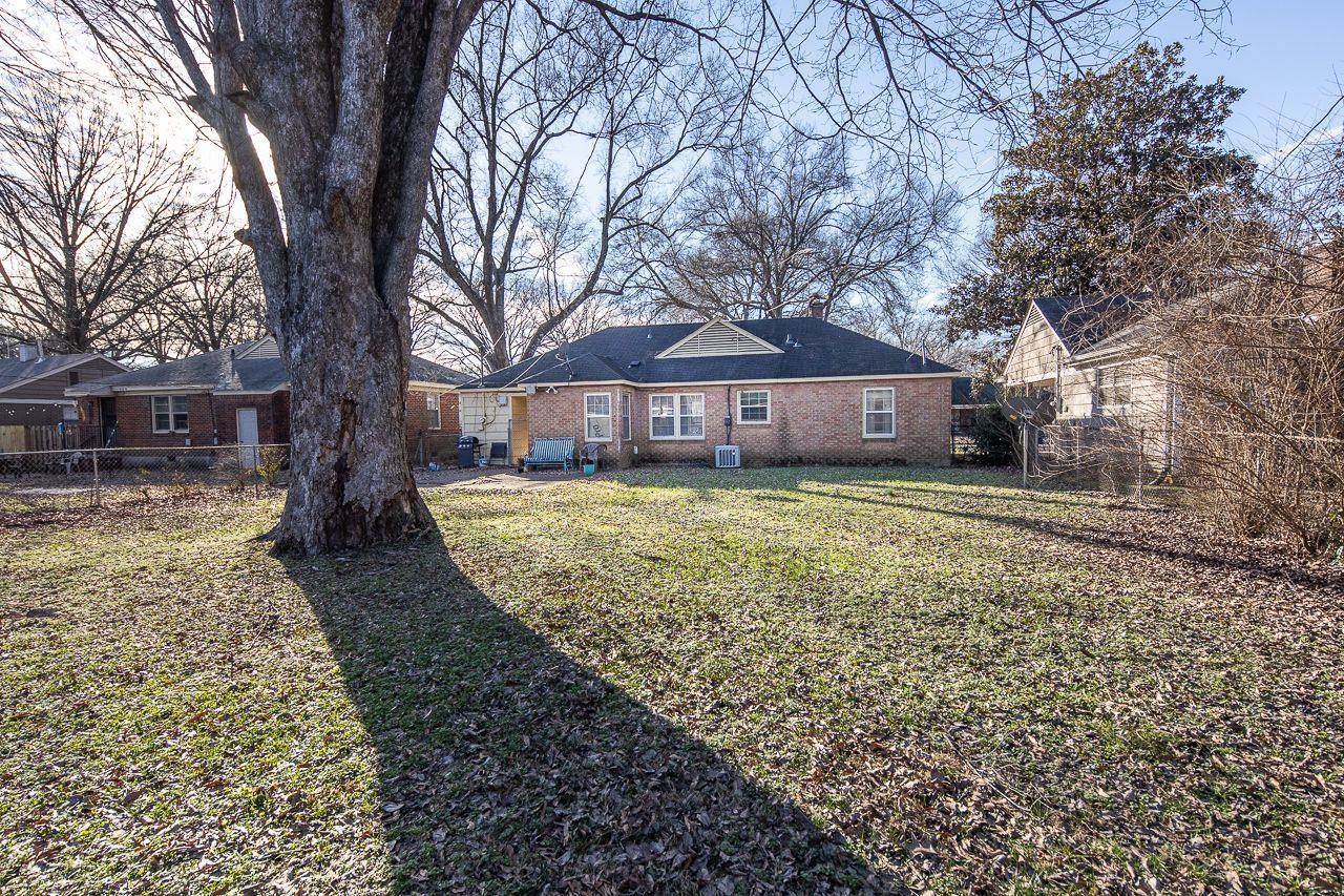 1632 Ivy Road Memphis, TN 38117 - Photo 14 of 14 a view of a house with a yard