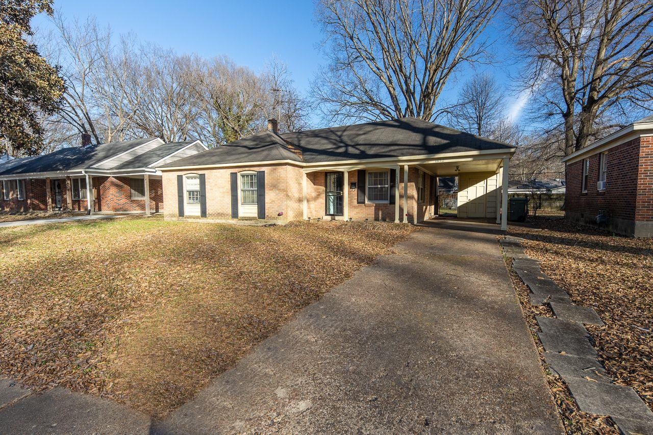 1632 Ivy Road Memphis, TN 38117 - Photo 2 of 14 a front view of a house with a yard
