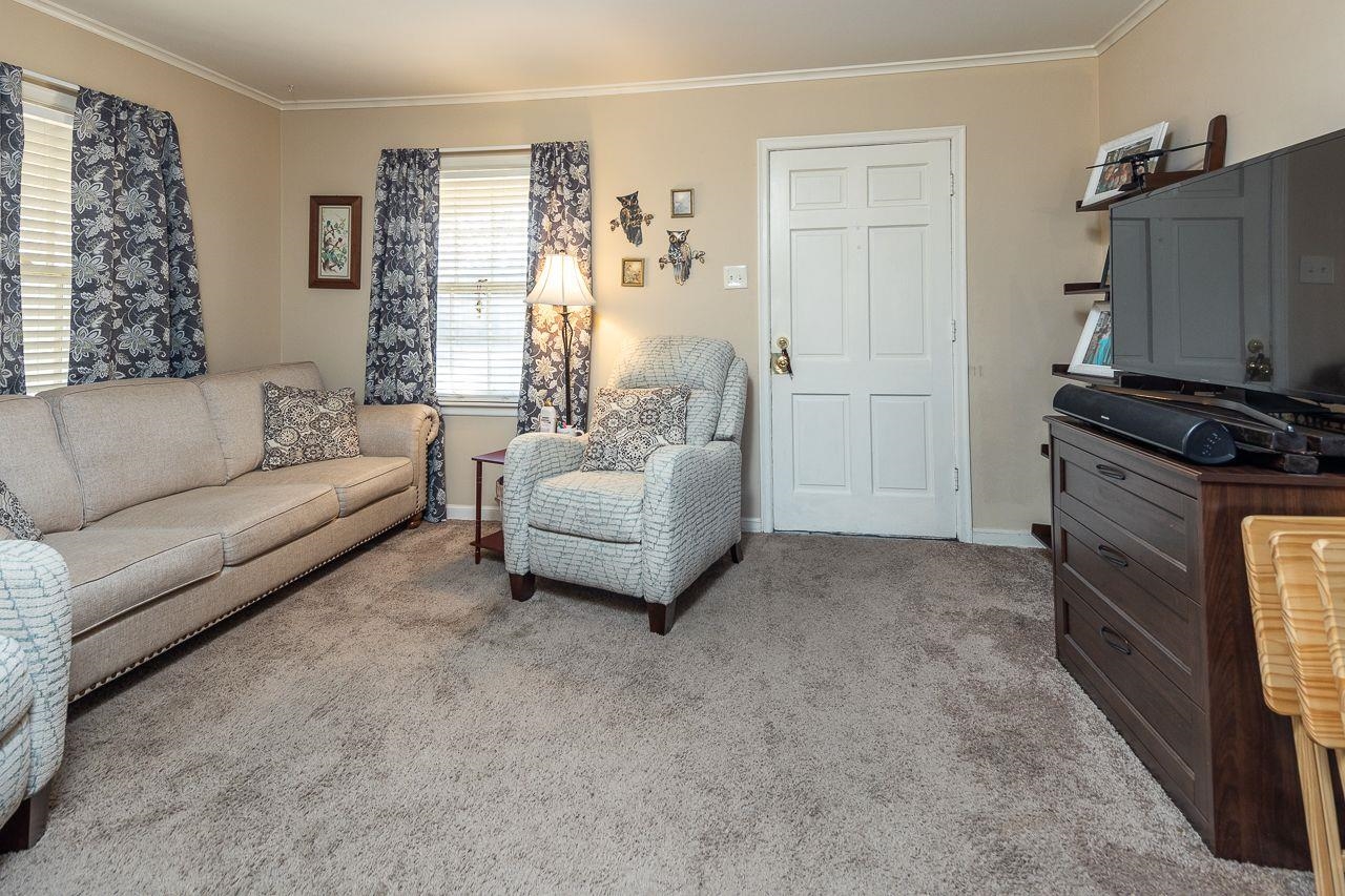 1632 Ivy Road Memphis, TN 38117 - Photo 4 of 14 a living room with furniture and a flat screen tv