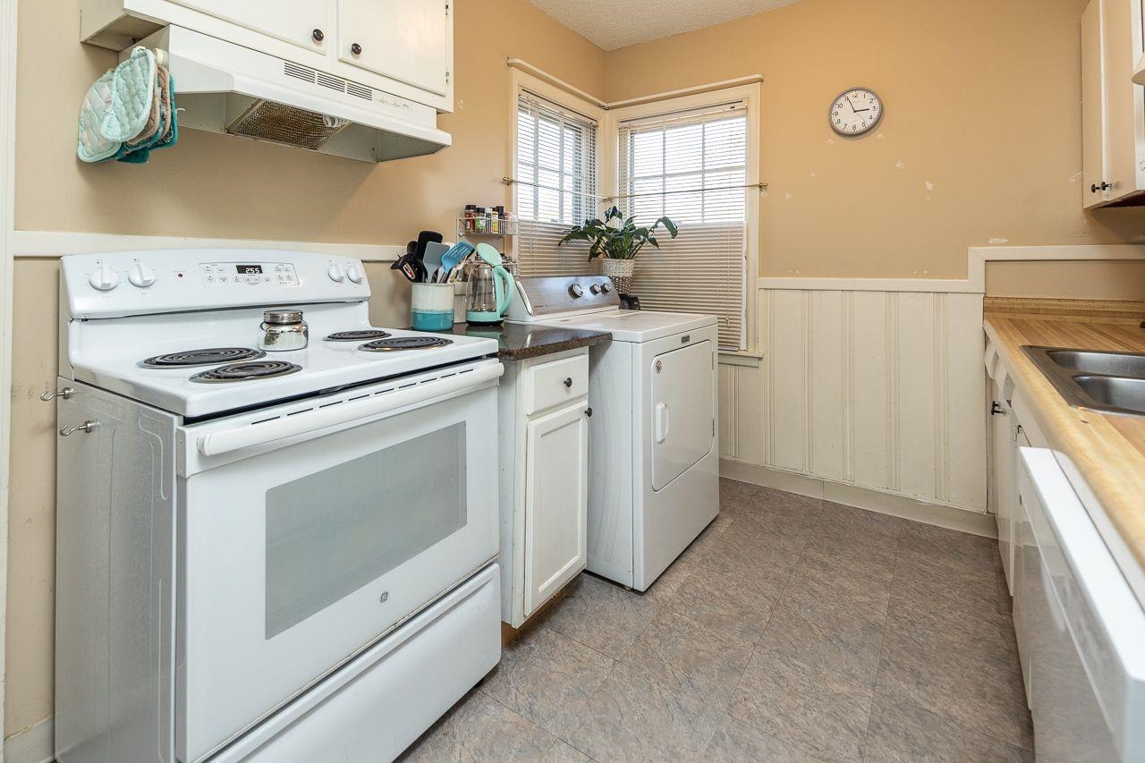 1632 Ivy Road Memphis, TN 38117 - Photo 7 of 14 a kitchen with cabinets appliances and wooden floor