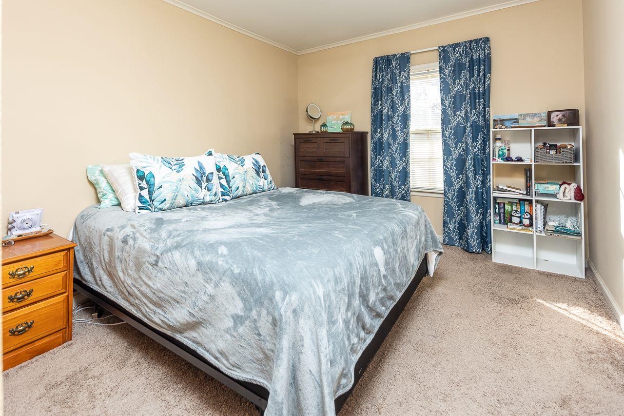 1632 Ivy Road Memphis, TN 38117 - Photo 9 of 14 a bedroom with a bed and a table