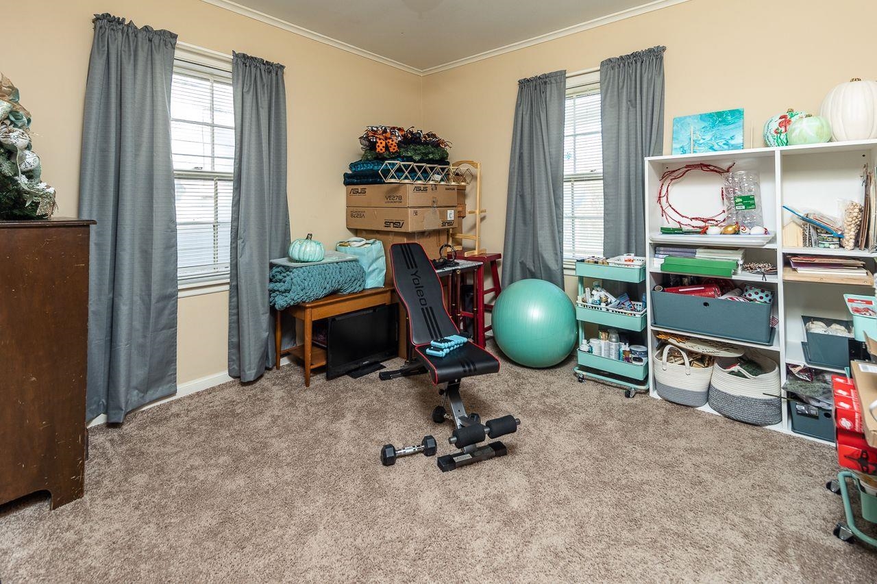 1632 Ivy Road Memphis, TN 38117 - Photo 10 of 14 a room with gym equipment and a large window