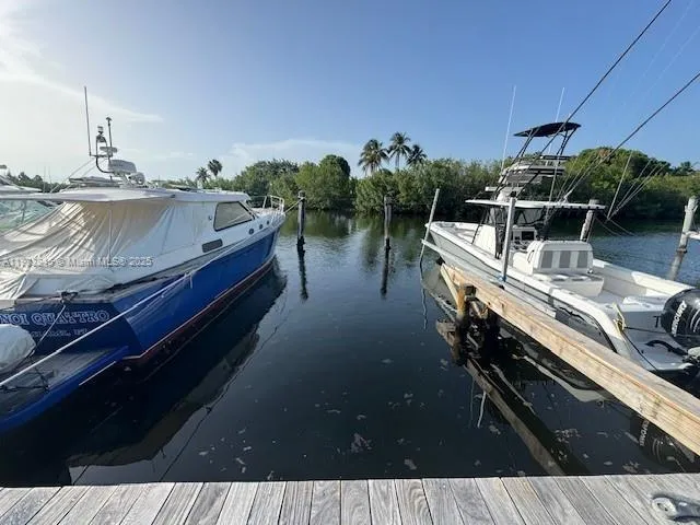 a terrace with outdoor seating and trees