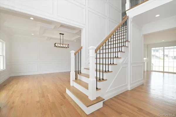 a view of entryway with wooden floor