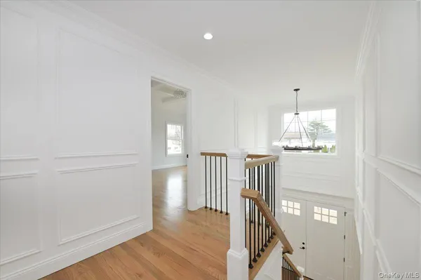 a view of entryway wooden floor and hall with wooden floor