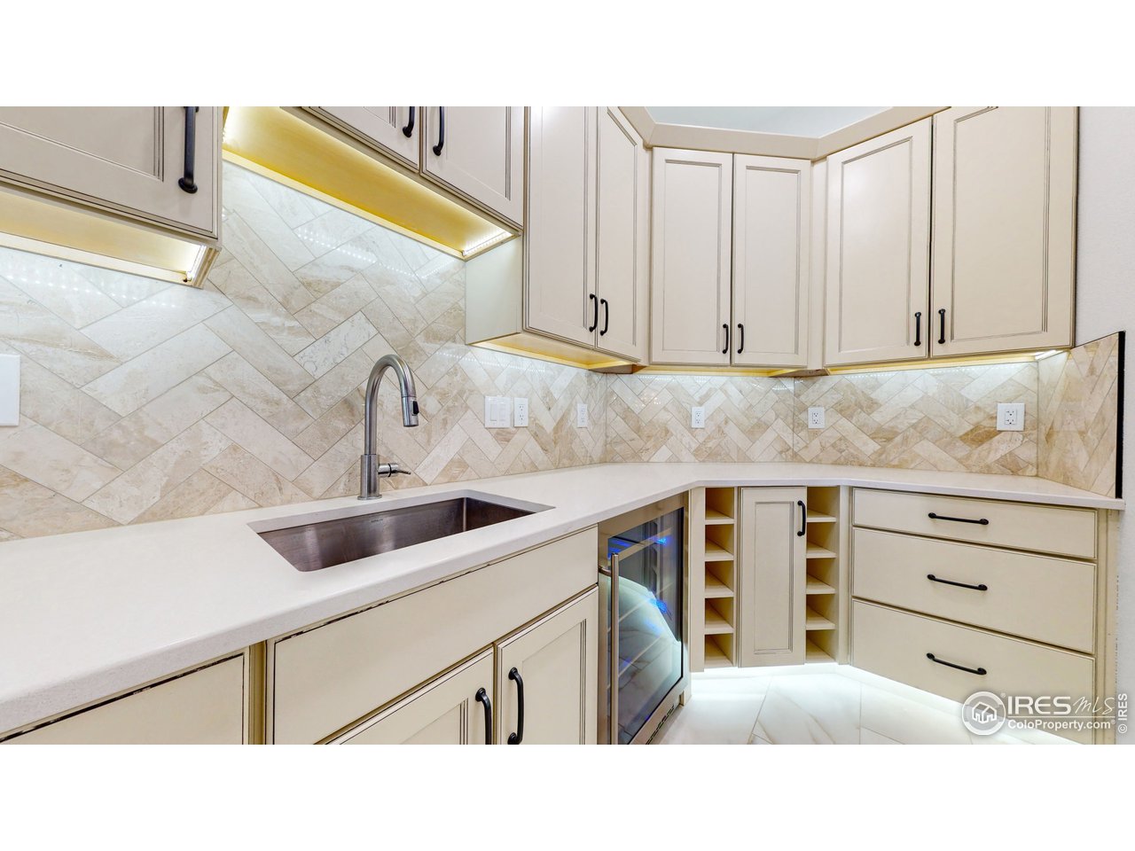 424 Grayhawk Road Fort Collins, CO 80524 - Photo 14 of 40 a kitchen with a sink and cabinets