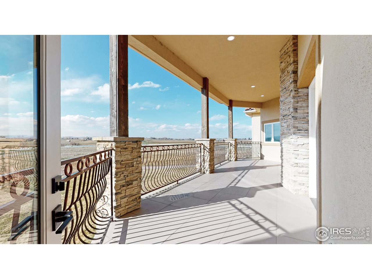 424 Grayhawk Road Fort Collins, CO 80524 - Photo 27 of 40 a view of a living room and a balcony