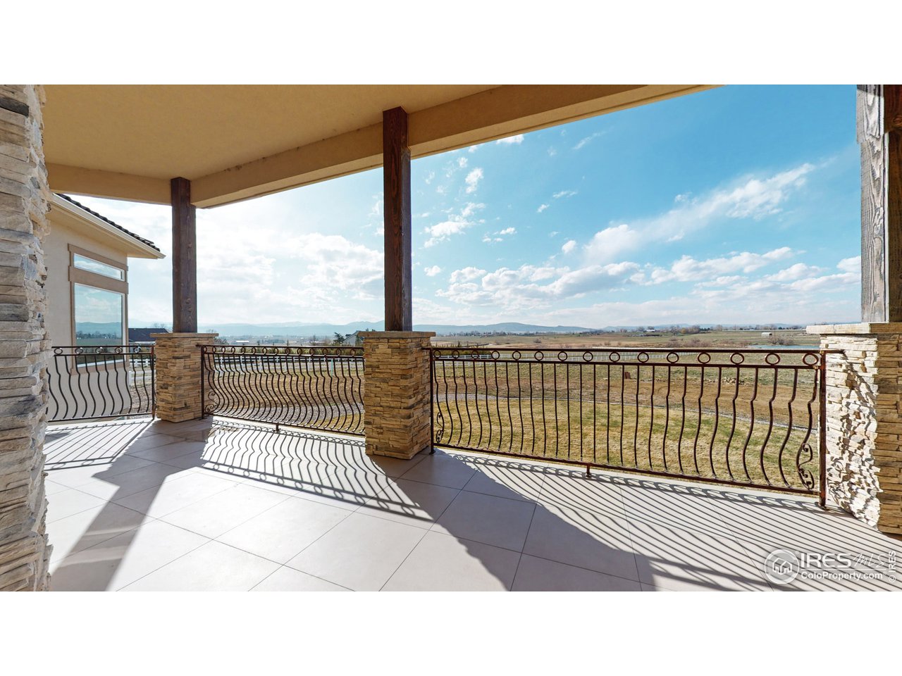 424 Grayhawk Road Fort Collins, CO 80524 - Photo 28 of 40 a balcony with a floor to ceiling window an outdoor view