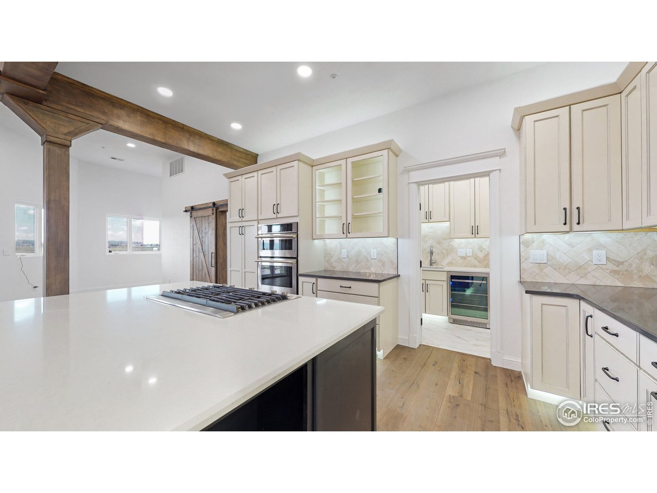 424 Grayhawk Road Fort Collins, CO 80524 - Photo 3 of 40 a kitchen with stainless steel appliances kitchen island granite countertop a sink refrigerator and cabinets