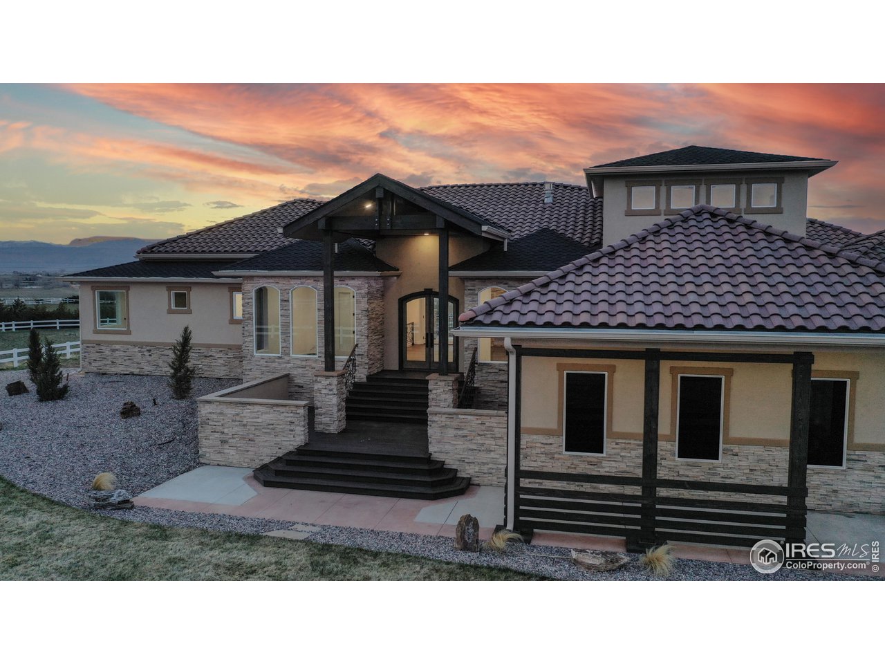 424 Grayhawk Road Fort Collins, CO 80524 - Photo 37 of 40 a front view of a house with a garden