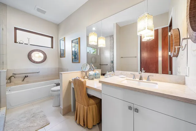 a bathroom with a toilet a sink and bathtub