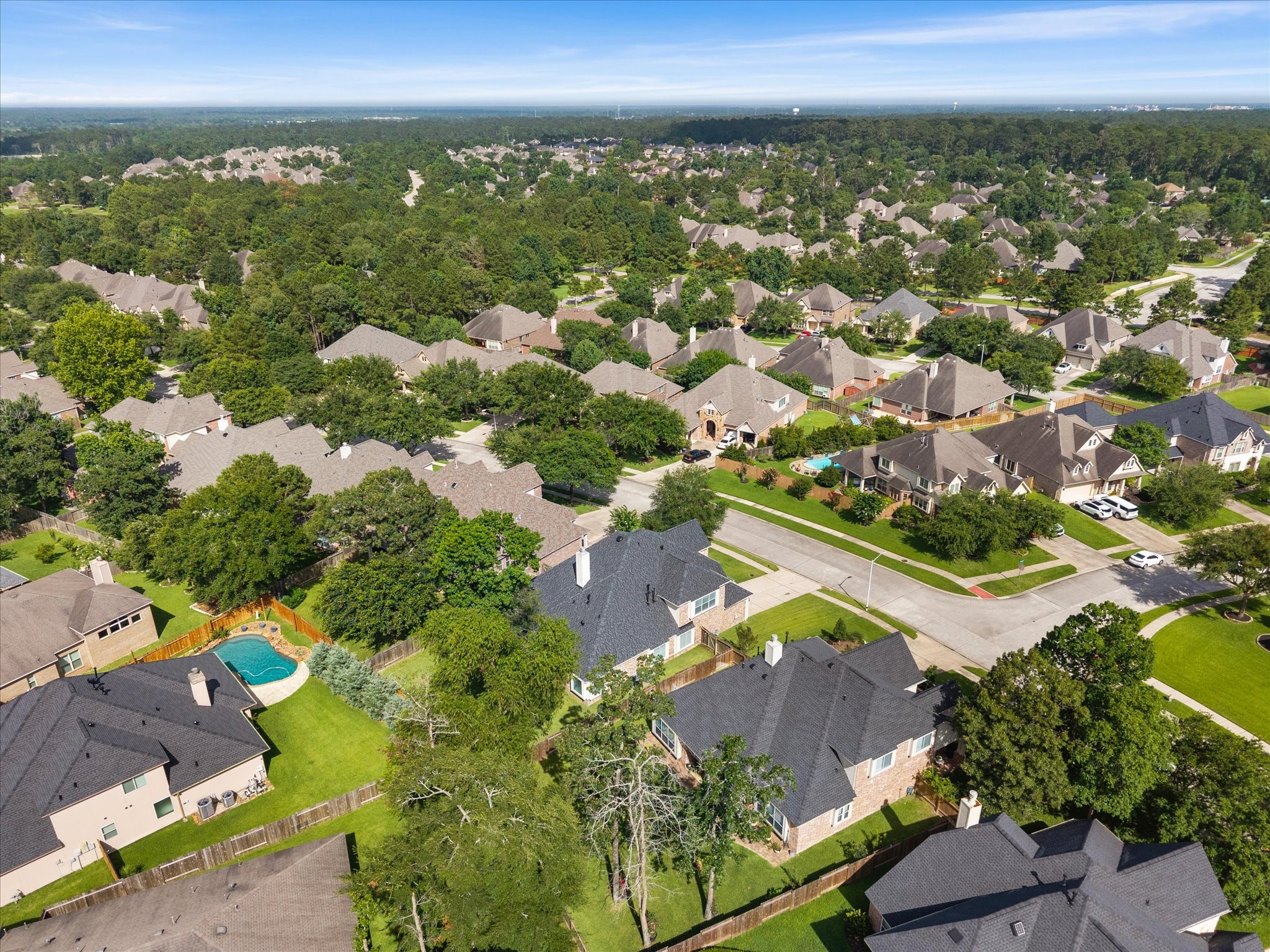 323 Arbor Ridge Lane Conroe, TX 77384 - Photo 39 of 40 This is the setting. A established, tree-filled community in Conroe with quick access to I-45 and zoned to The Woodlands College Park High. The kind of neighborhood people put down roots in.