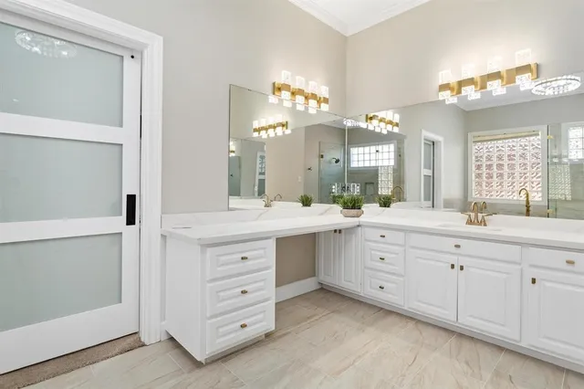 a spacious bathroom with a double vanity sink mirror and a