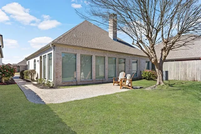 a view of a house with backyard porch and sitting area