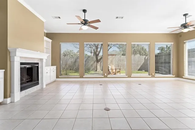 a view of an empty room with a fireplace