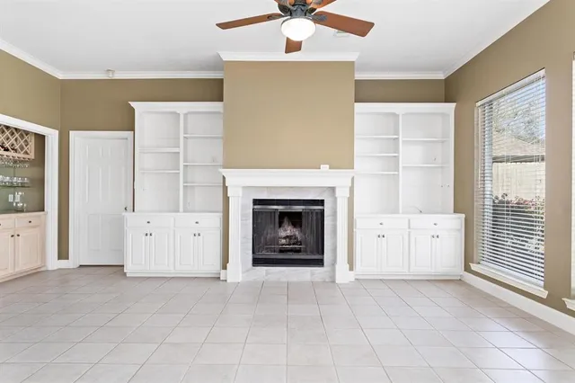 a view of livingroom with furniture and a fireplace