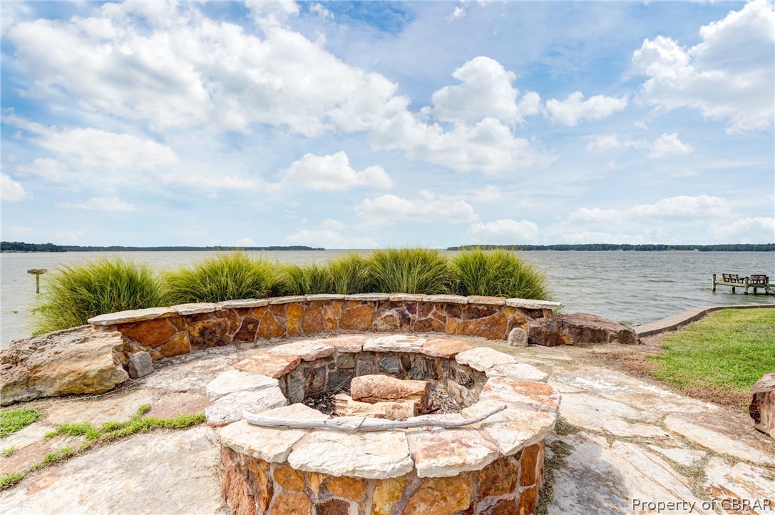 4661 Black Stump Road Weems, VA 22576 - Photo 14 of 34 firepit with imported stone