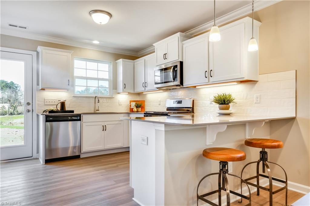 3907 Straw Hat Road Greensboro, NC 27410 - Photo 6 of 26 Similar to Kitchen -- Lot 50 will have grey cabinets and blanco matrix countertop
