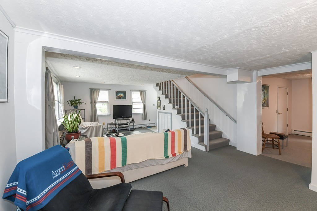 34 Clinton Street Waltham, MA 02453 - Photo 12 of 20 a living room with furniture and a flat screen tv