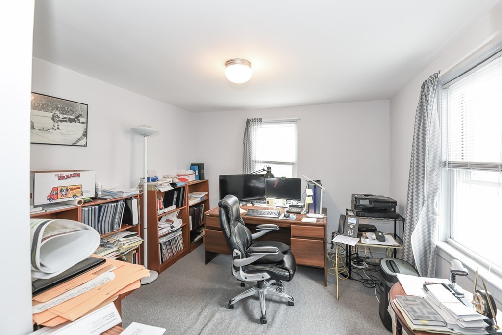 34 Clinton Street Waltham, MA 02453 - Photo 13 of 20 a view of a workspace with furniture and a window