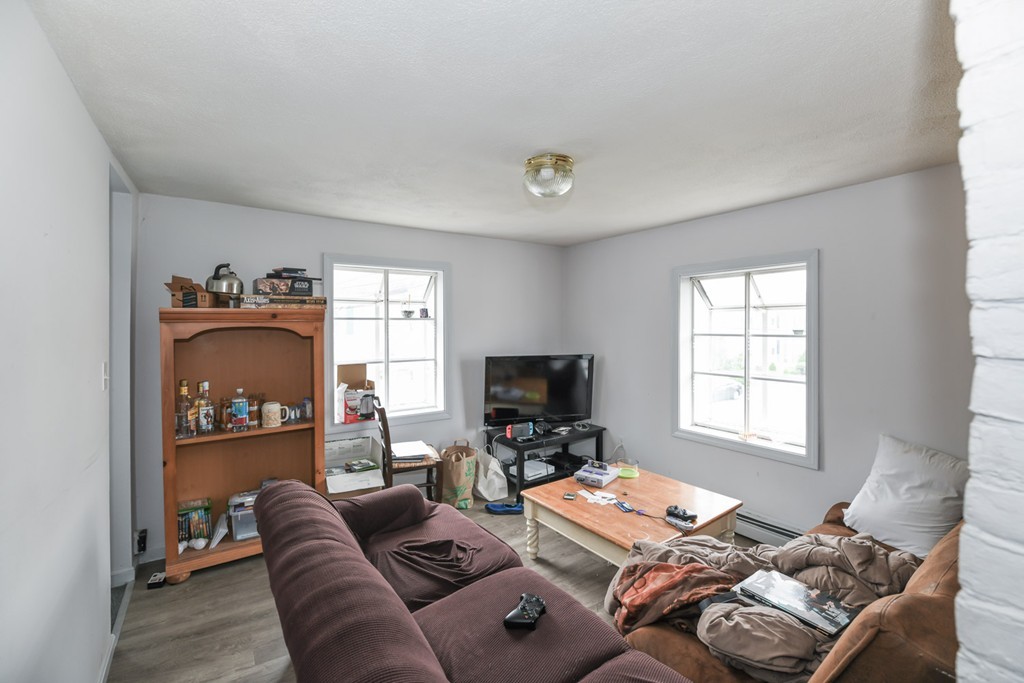 34 Clinton Street Waltham, MA 02453 - Photo 17 of 20 a living room with furniture and a window