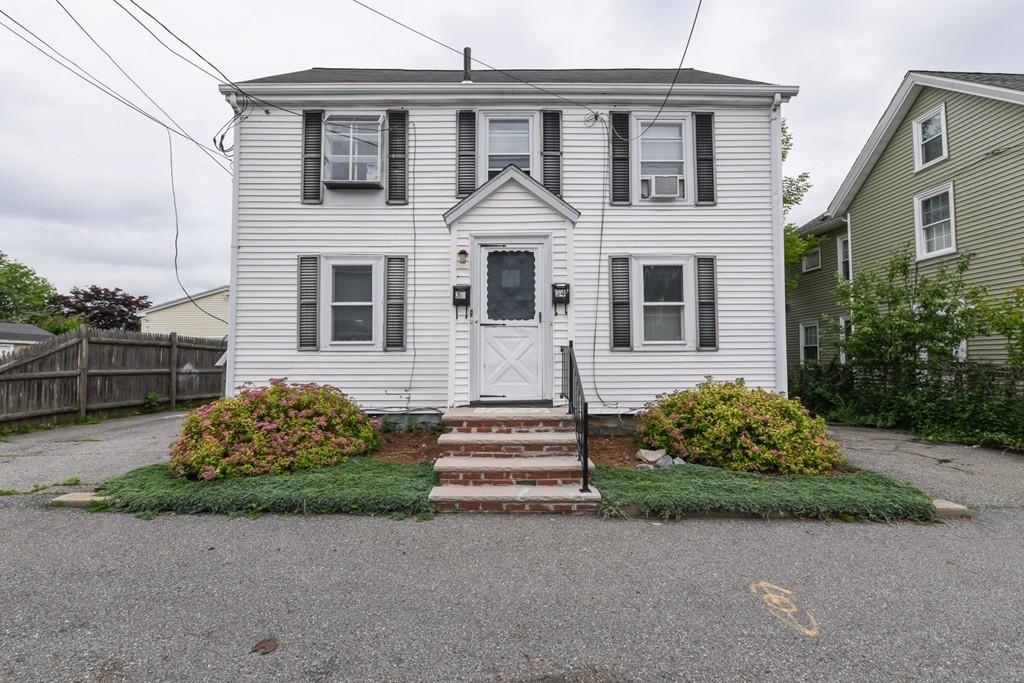 34 Clinton Street Waltham, MA 02453 - Photo 2 of 20 front view of a house with a yard