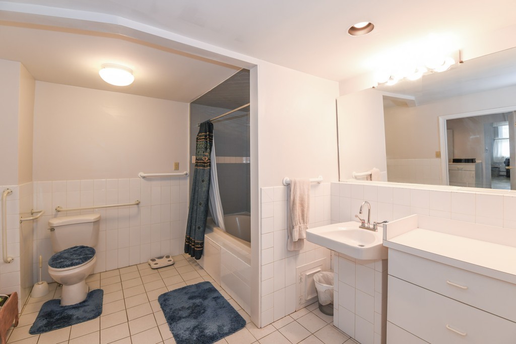 34 Clinton Street Waltham, MA 02453 - Photo 7 of 20 a bathroom with a sink toilet and a mirror