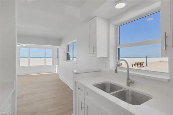 a kitchen with a sink and cabinets