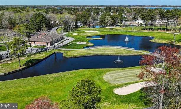 a view of a swimming pool with a yard