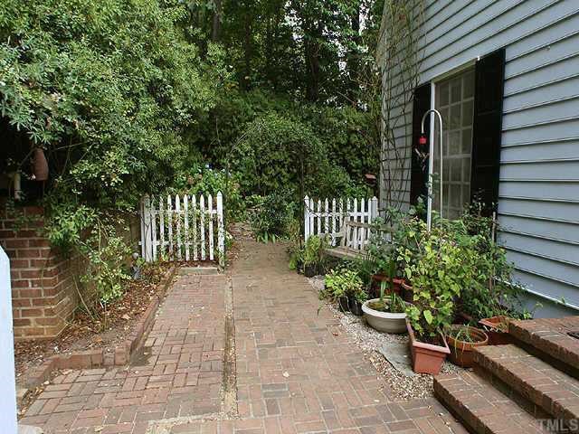 2004 Rangecrest Road Raleigh, NC 27612 - Photo 7 of 10 a view of a pathway with a garden