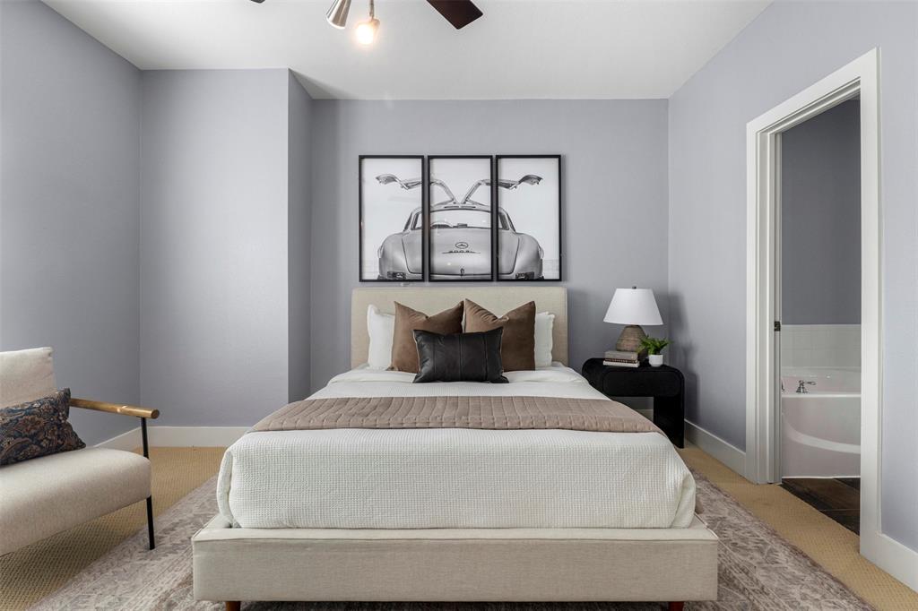 4830 Cedar Springs Road, Unit 30 Dallas, TX 75219 - Photo 13 of 32 a bedroom with a bed and a window