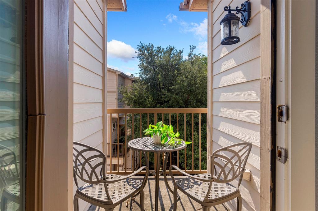 4830 Cedar Springs Road, Unit 30 Dallas, TX 75219 - Photo 15 of 32 a view of a chairs and table on the balcony
