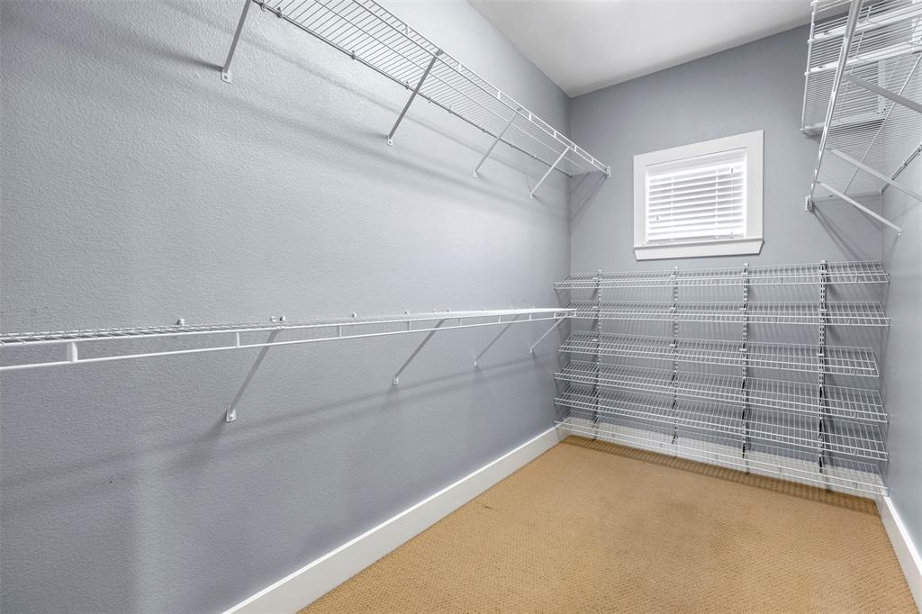 4830 Cedar Springs Road, Unit 30 Dallas, TX 75219 - Photo 18 of 32 a view of a room with racks on the wall