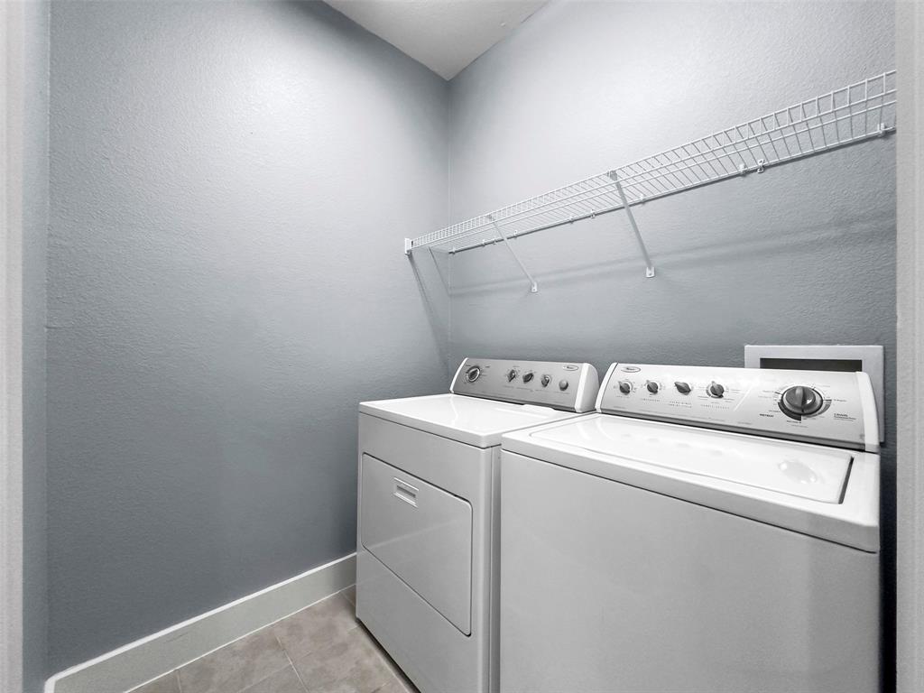 4830 Cedar Springs Road, Unit 30 Dallas, TX 75219 - Photo 24 of 32 a utility room with dryer and washer