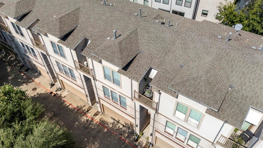 4830 Cedar Springs Road, Unit 30 Dallas, TX 75219 - Photo 26 of 32 an aerial view of a house with a yard and balcony