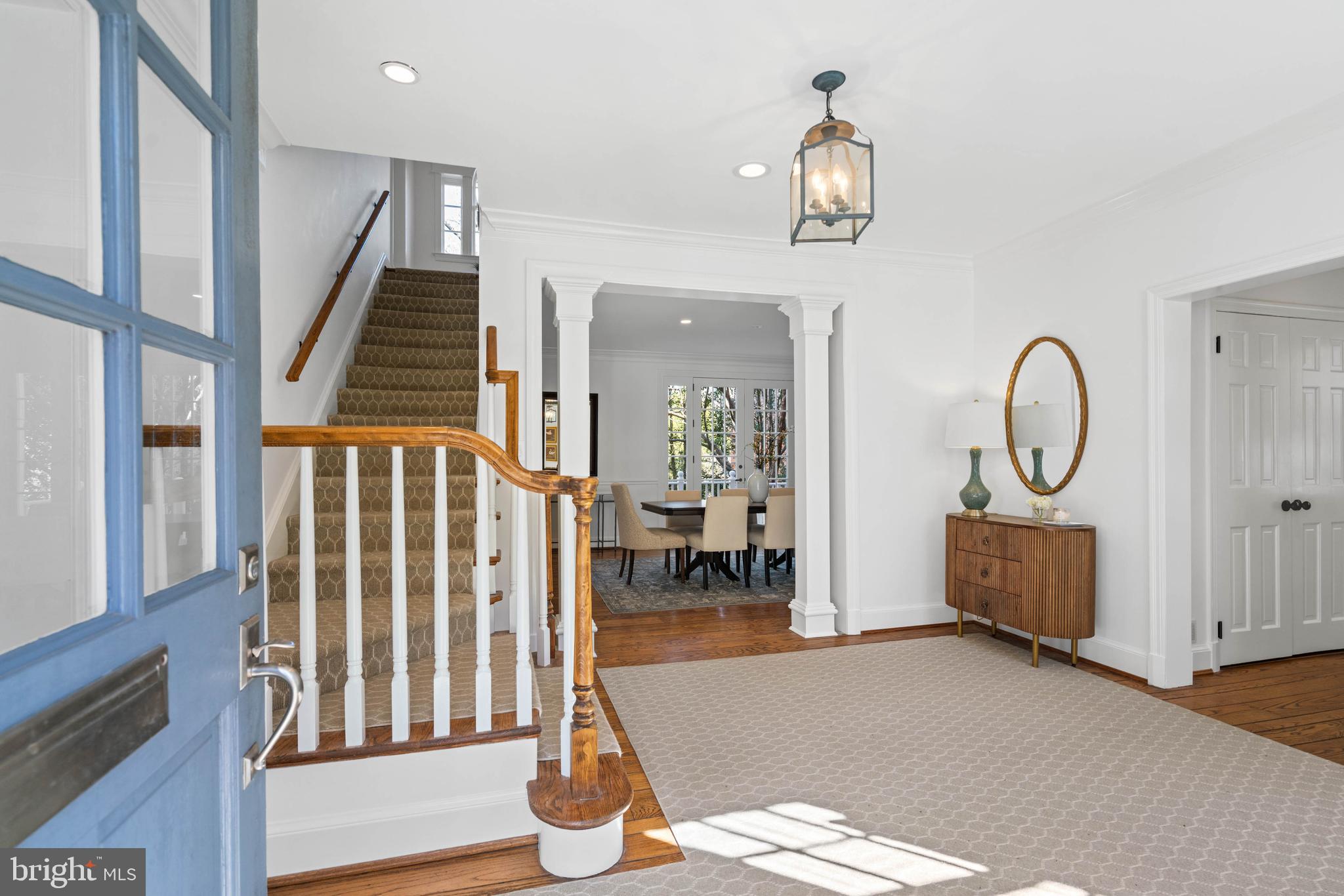 3549 Springland Lane Northwest Washington, DC 20008 - Photo 2 of 47 a living room with couches and a dining table with wooden floor