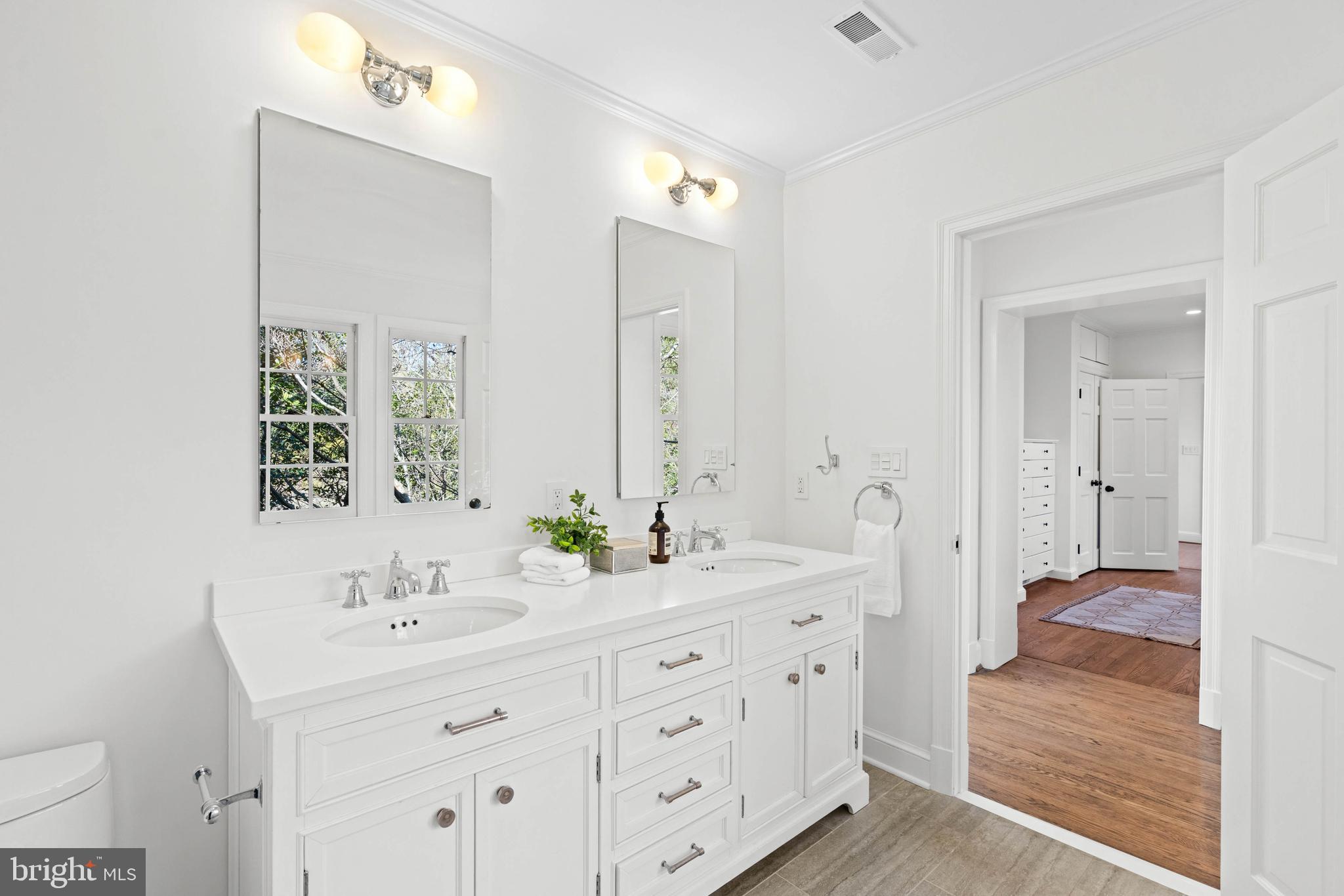 3549 Springland Lane Northwest Washington, DC 20008 - Photo 23 of 47 a en suite bathroom with double sink and a large mirror