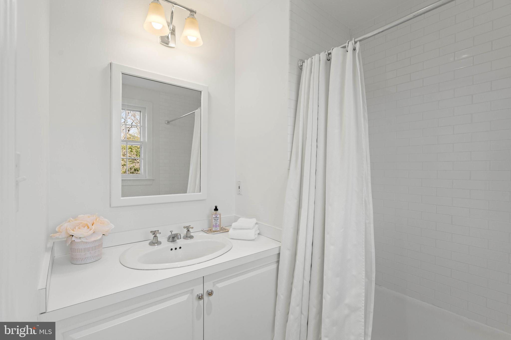3549 Springland Lane Northwest Washington, DC 20008 - Photo 30 of 47 a bathroom with a sink and a mirror