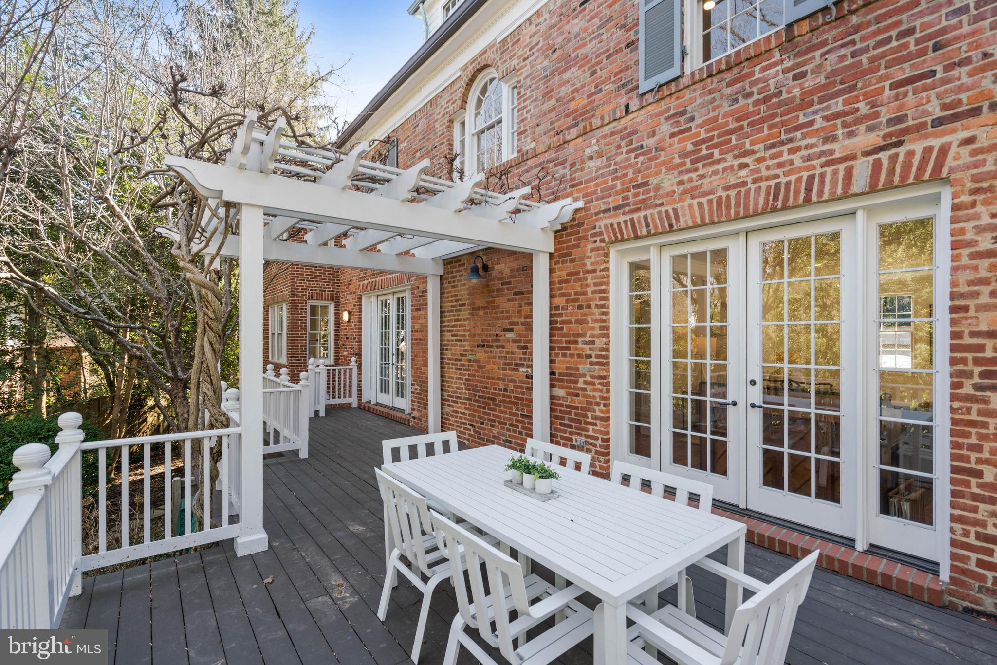 3549 Springland Lane Northwest Washington, DC 20008 - Photo 42 of 47 a view of a patio with table and chairs and wooden floor