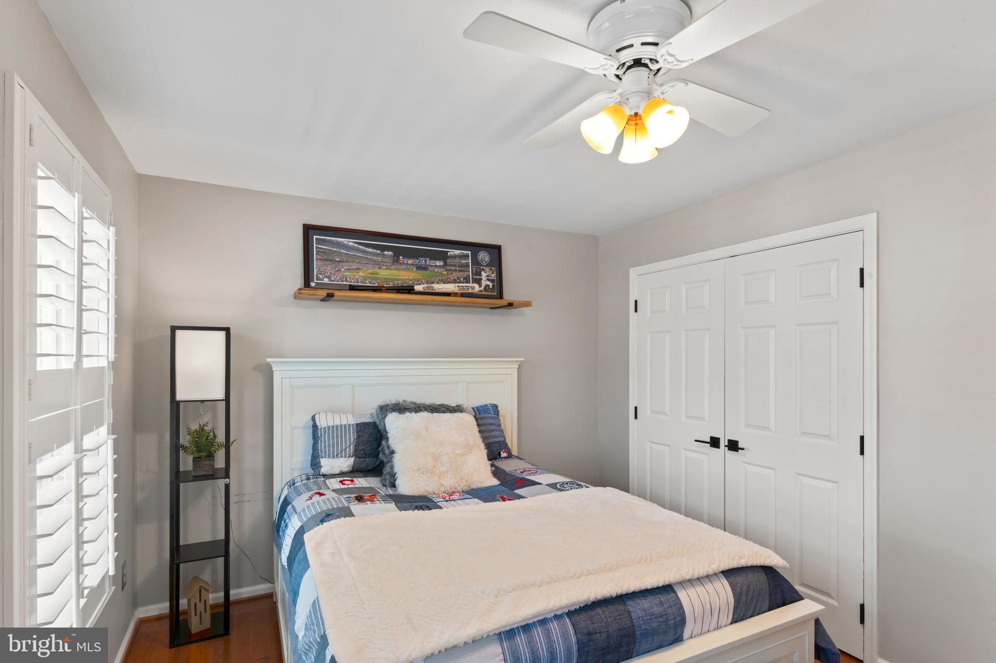 2519 Fallon Drive Herndon, VA 20171 - Photo 42 of 107 a bedroom with a bed and a chandelier